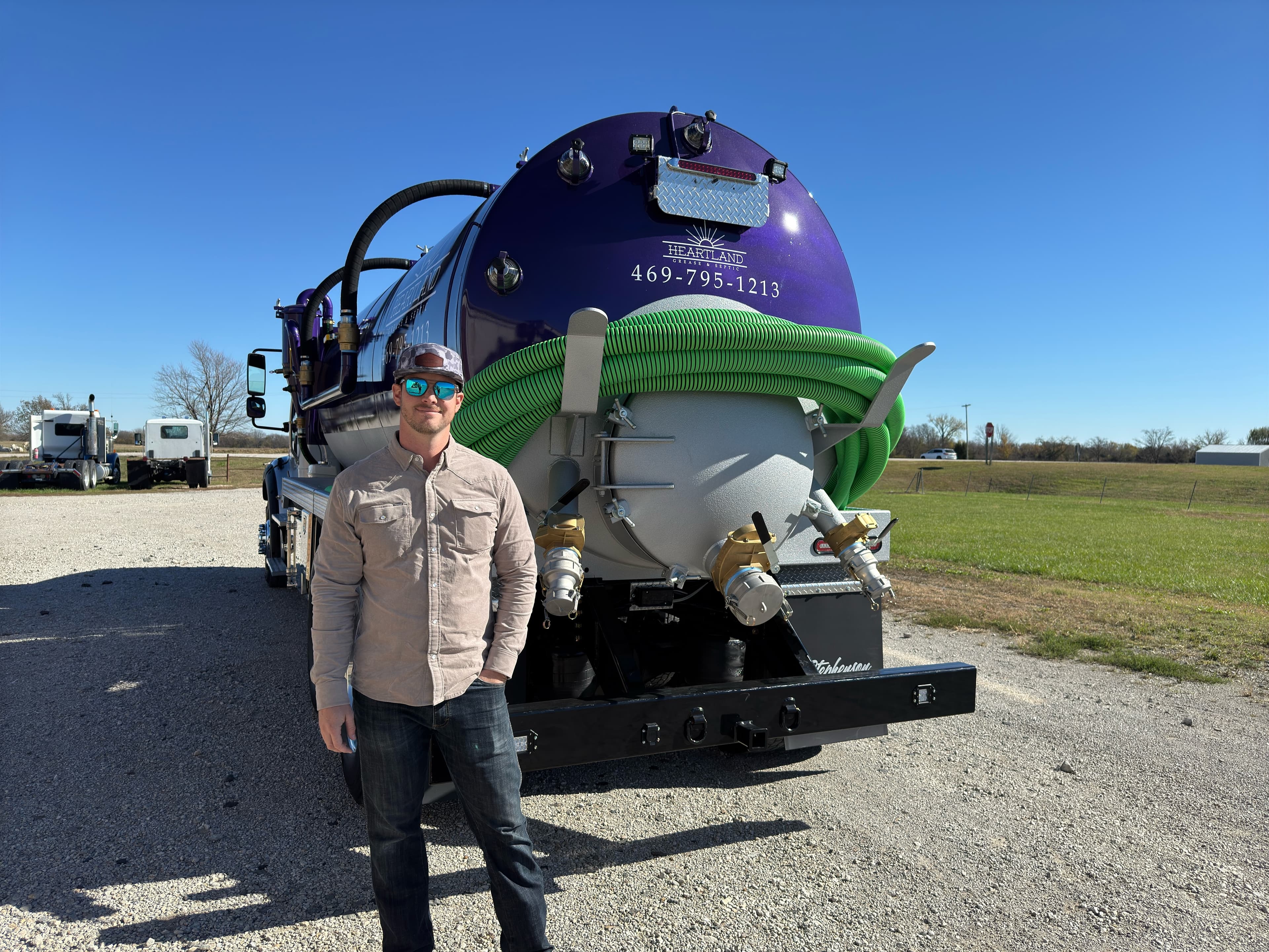 Kyle with the Heartland Grease & Septic service truck in Plano, TX